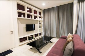 Apartment, 2 Bedrooms | Living room | Flat-screen TV