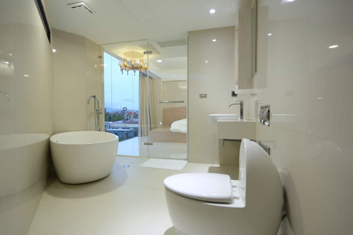 superior double room | bathroom | shower, hair dryer, slippers, towels