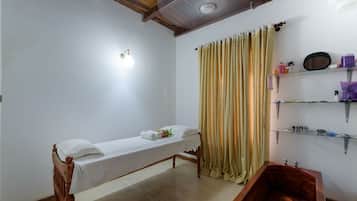 Relax in this serene space with a single bed, wooden bench, and a small tub for soaking.