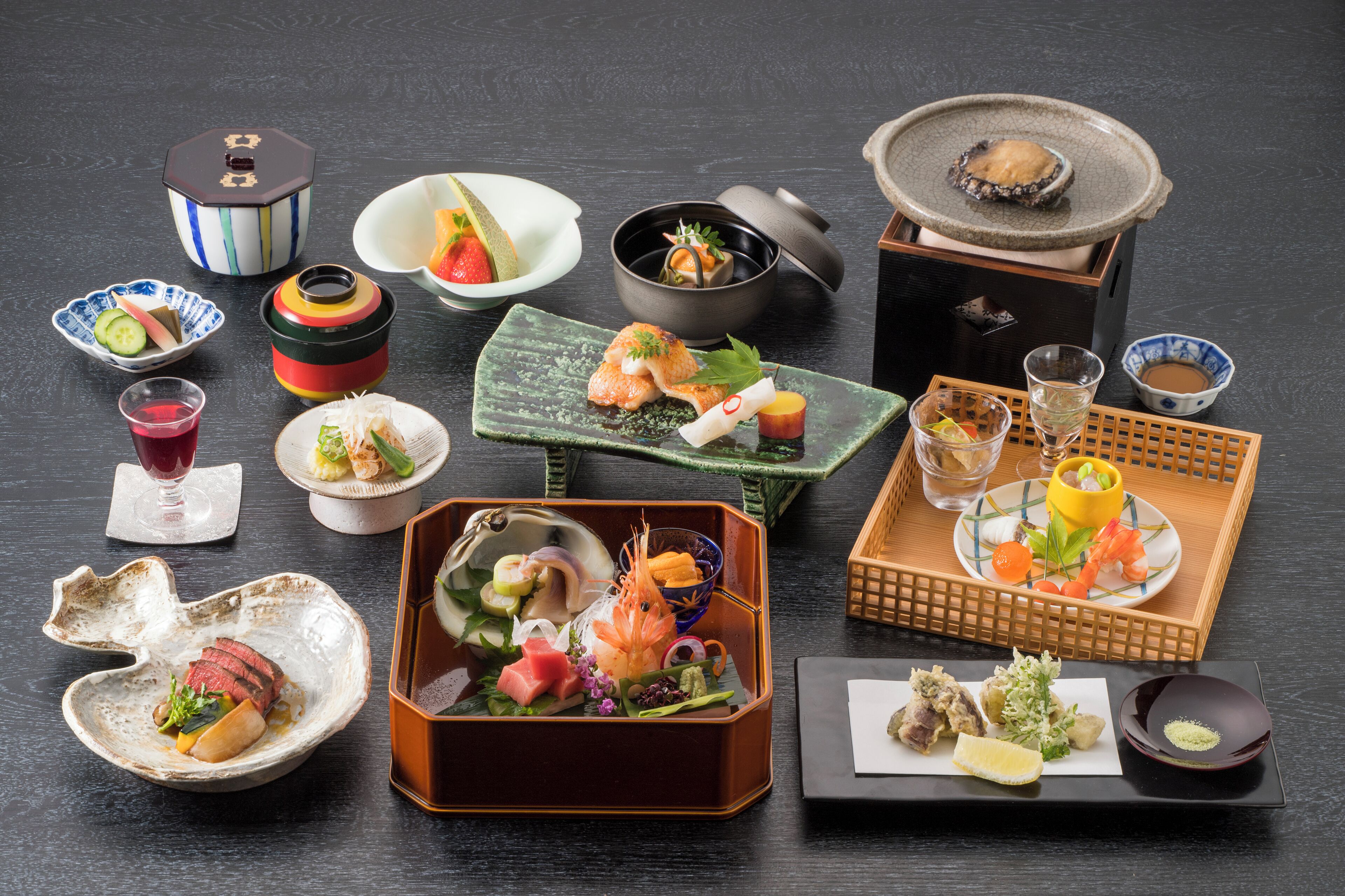 A variety of Japanese dishes and containers on a table.