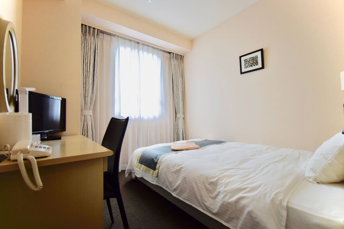 Desk, laptop workspace, blackout curtains, soundproofing