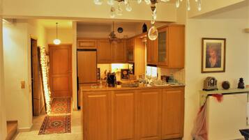 Villa | Private kitchen | Full-size fridge, microwave, oven, stovetop