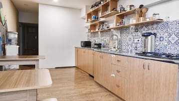 Full-sized fridge, microwave, stovetop, coffee/tea maker