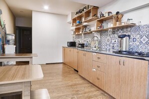 Full-sized fridge, microwave, stovetop, coffee/tea maker