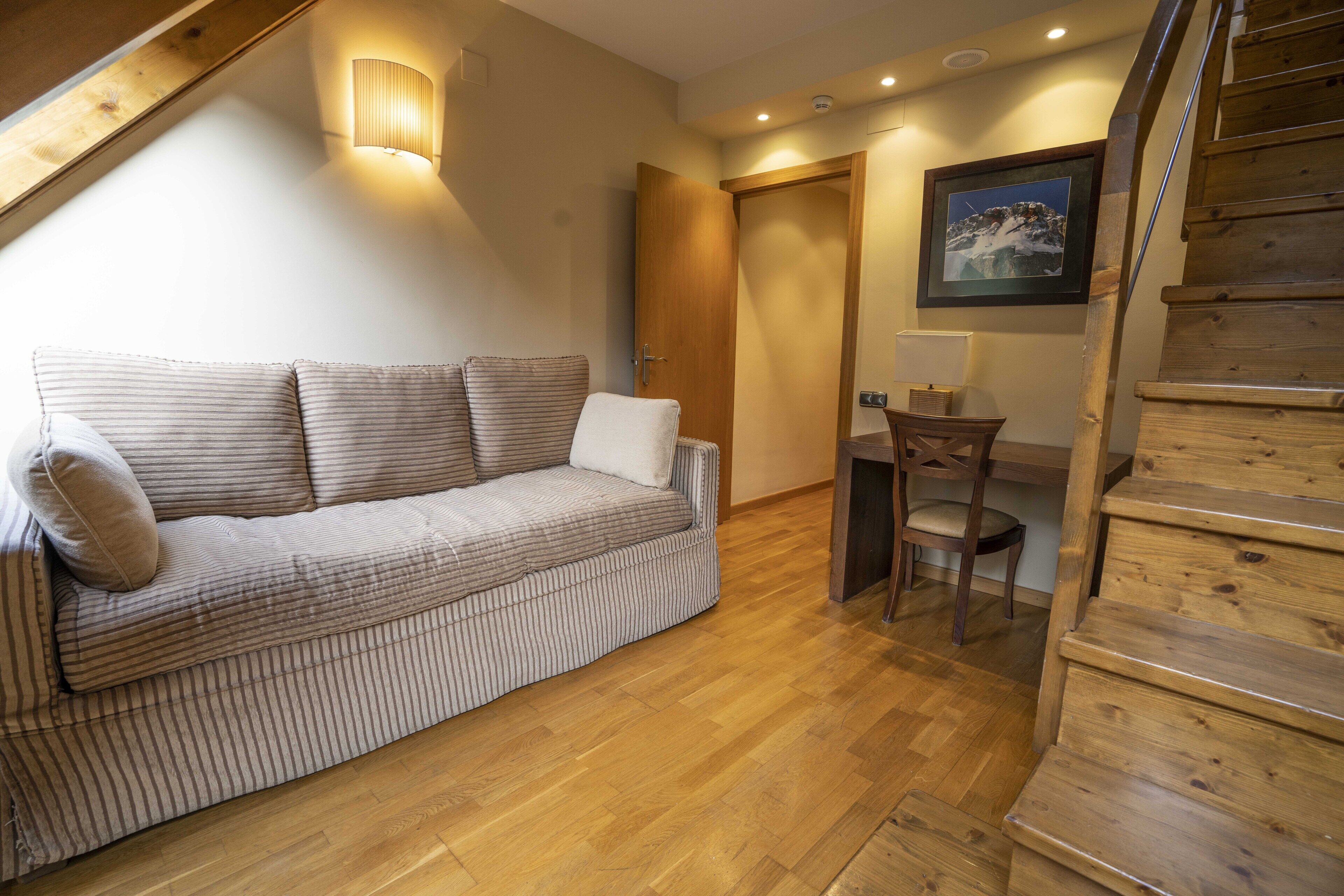 junior suite | 1 bedroom, in-room safe, desk, blackout curtains