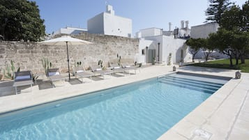 Seasonal outdoor pool, open 8:00 AM to 7:30 PM, pool umbrellas