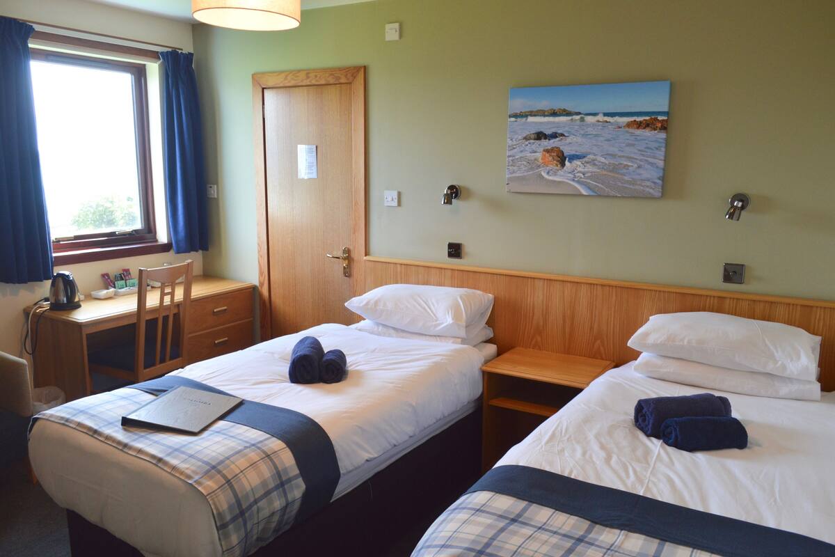 Twin Room, Sea View | In-room safe, desk, iron/ironing board (on request), free WiFi