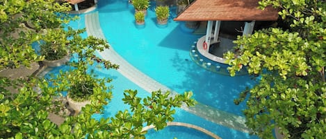 Outdoor pool, pool loungers, lifeguards on site