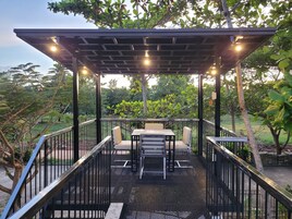 Premium Quadruple Room, Balcony, Pool View | Terrace/patio