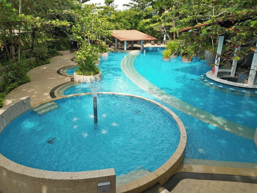 Outdoor pool, pool loungers, lifeguards on site