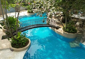 Outdoor pool, pool loungers, lifeguards on site