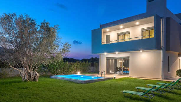 A modern two-story house with a swimming pool and outdoor seating. - Filerimos Villa (Rhodes)