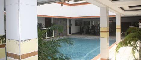 Outdoor pool, open 6:00 AM to 6:00 PM, pool loungers