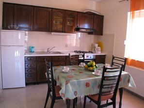 Apartment, Ground Floor | Private kitchen | Fridge, microwave, stovetop, electric kettle - Apartments Bareta (Trogir)