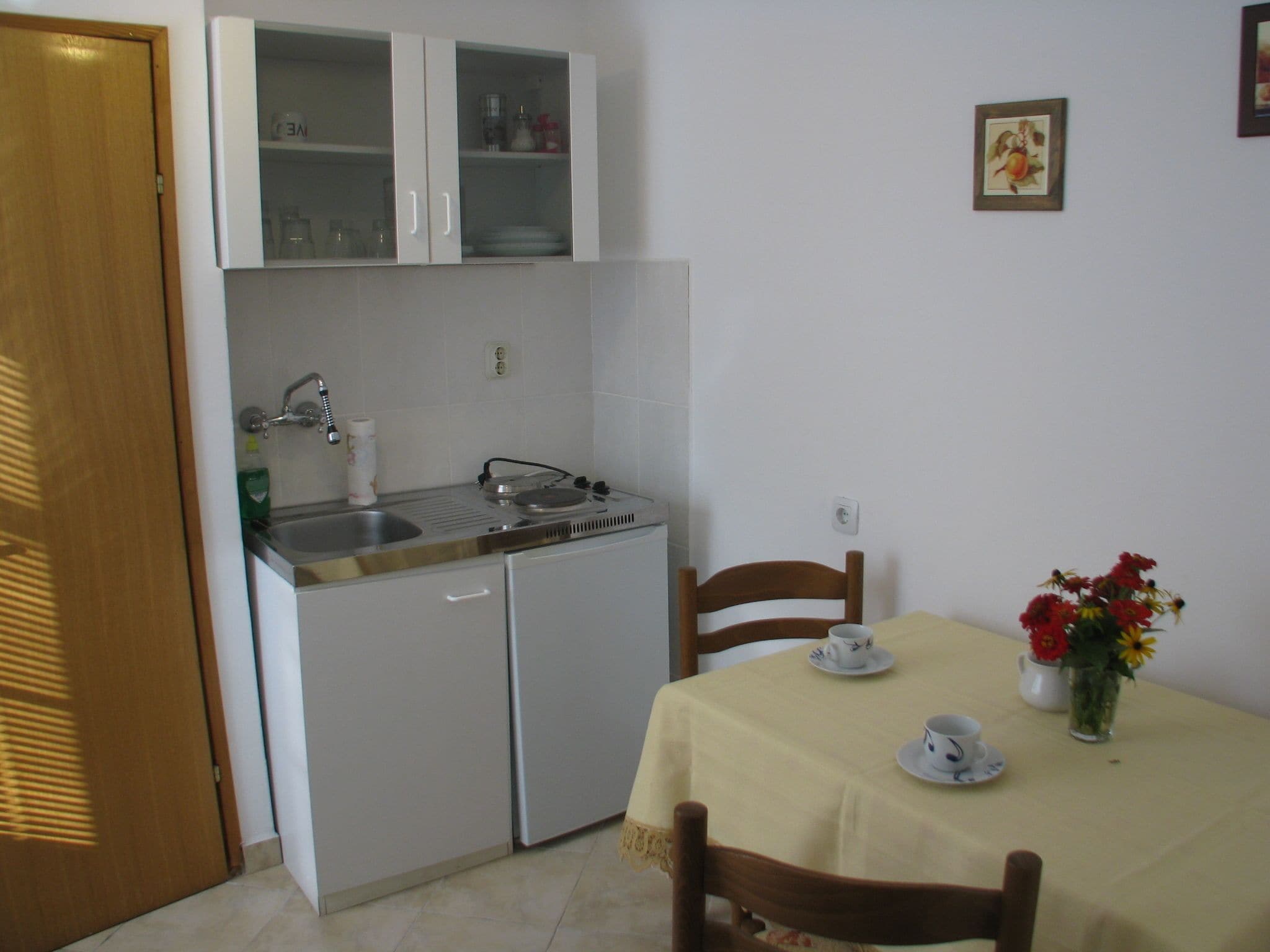 Apartment, Ground Floor | Private kitchenette | Fridge, stovetop, electric kettle, cookware/dishes/utensils