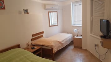 Apartamento, no piso térreo | Wi-Fi de cortesia, roupa de cama