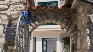A stone building with a metal gate and a tiled entrance. - Split Center Suites (Split)