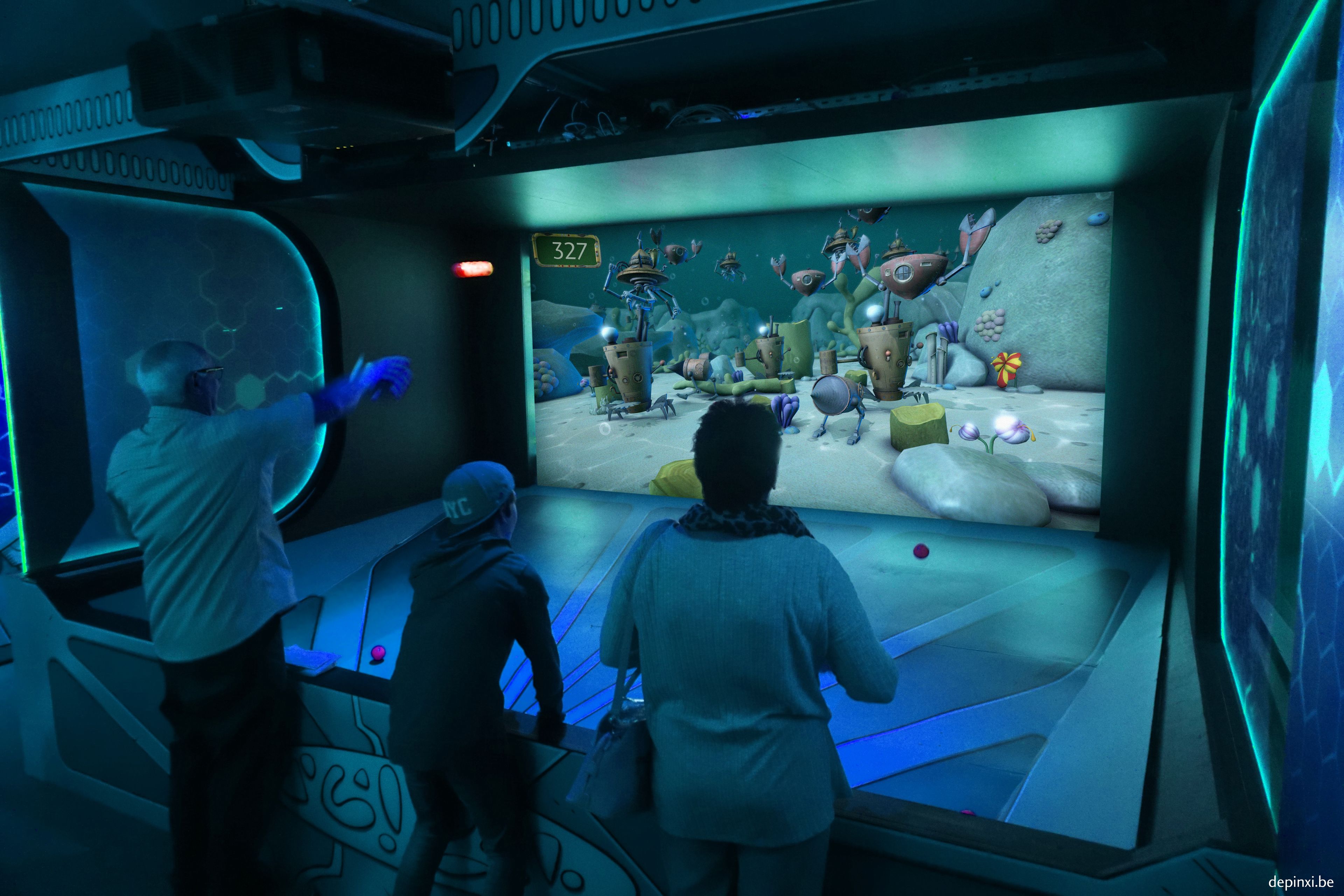 A room with a large interactive display, a bed, and a bedside table.