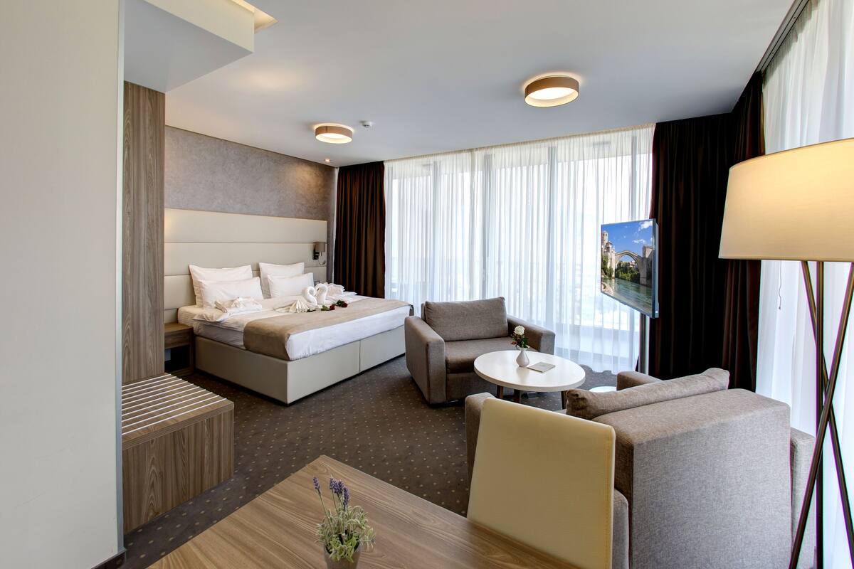 suite, balcony, city view | minibar, in-room safe, desk, blackout curtains