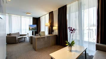 Suite, Balcony, City View | Minibar, in-room safe, desk, blackout curtains