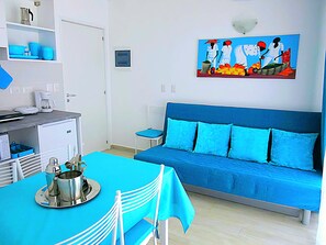 Deluxe Suite, Terrace, Pool View | Living area | Flat-screen TV - Coral Village - Apartments Caribbean Cocktails (Punta Cana)