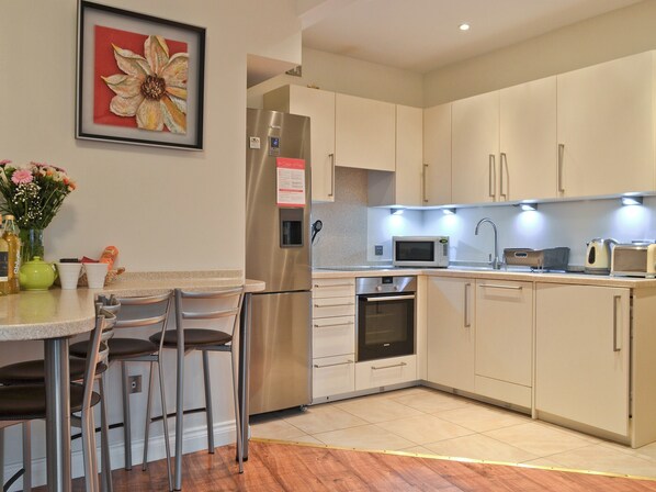 Dishwasher, high chair, cookware/dishes/utensils