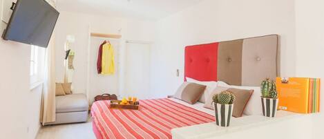 1 habitación, tabla de planchar con plancha y cuna de viaje