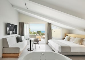 Suite, vistas al mar | 1 dormitorio, caja fuerte, escritorio y wifi gratis