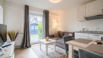 Apartemen | Area keluarga | TV layar datar, stasiun docking iPod, dan stasiun docking MP3