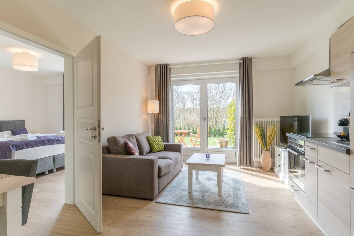 Appartement, terrasse | Aire de séjour | Téléviseur à écran plat