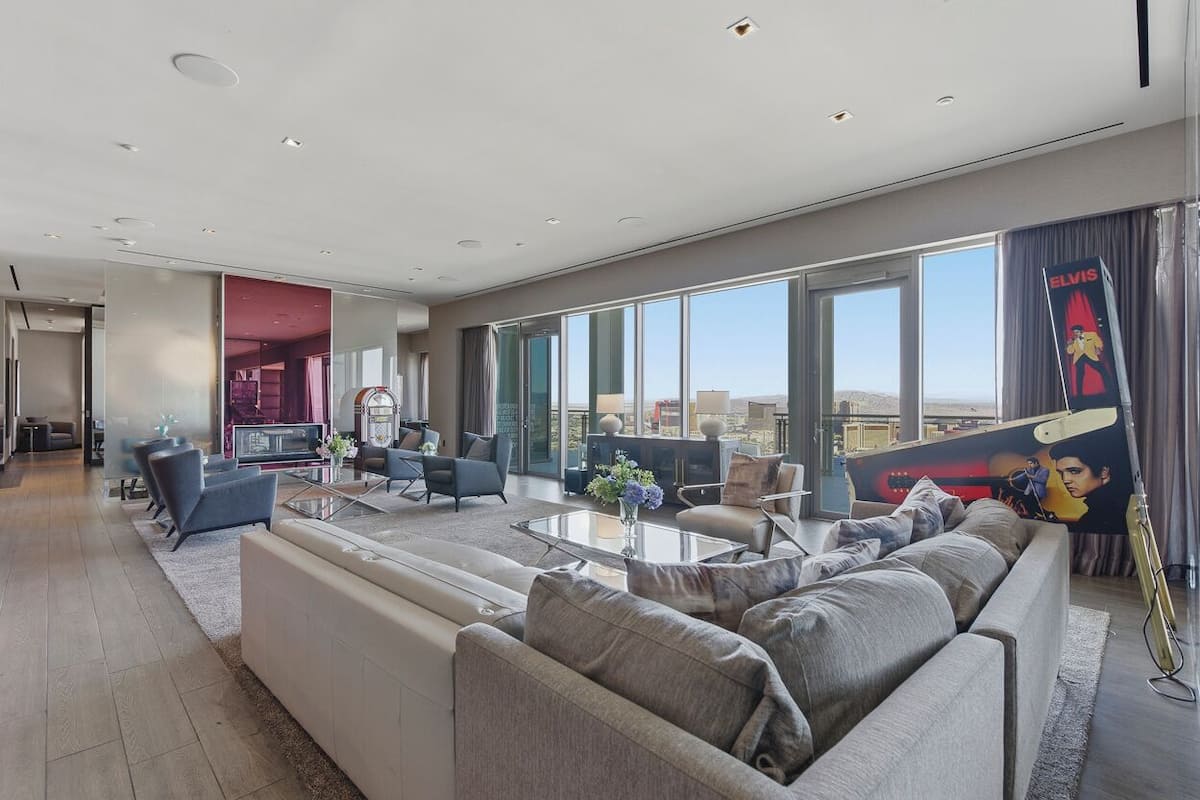 Designer Penthouse | Full Strip View | Jacuzzi Unavailable | Living area | 65-inch Smart TV with cable channels, TV, fireplace