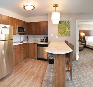 Suite, 1 Bedroom, Kitchen | Private kitchen | Full-size fridge, microwave, stovetop, dishwasher - Staybridge Suites Red Deer North  by IHG (Red Deer)