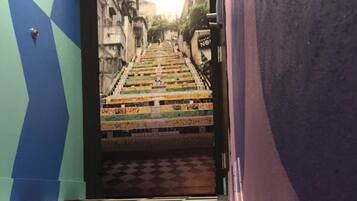 A staircase leading to a street with a sign that reads "hostel NO1".