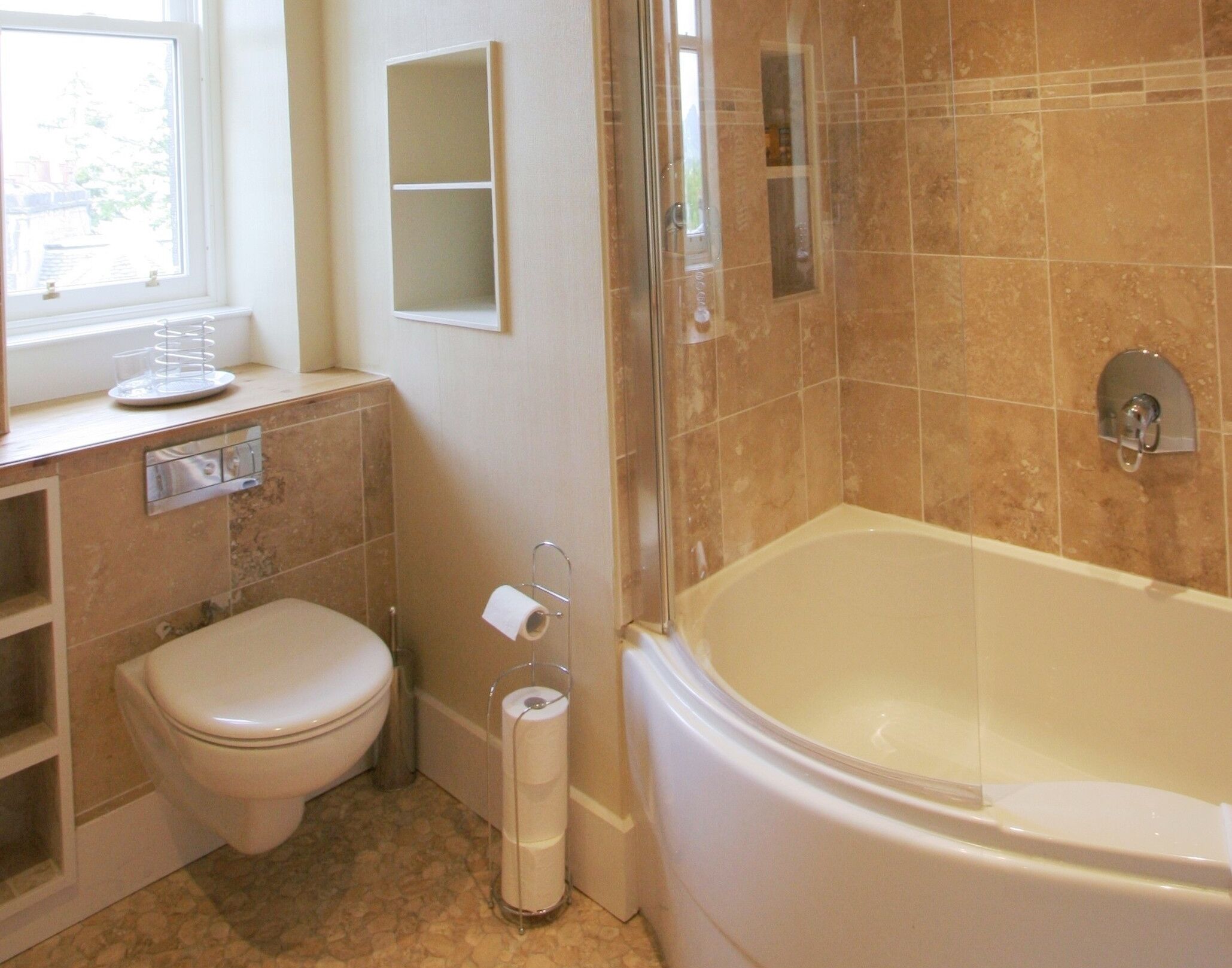 Combined shower/bathtub, hair dryer, towels, toilet paper