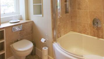 Combined shower/bathtub, hair dryer, towels, toilet paper