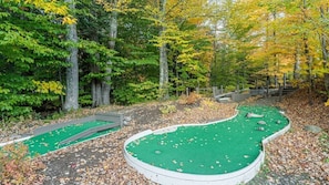 Play a round of golf amidst the serene woods.