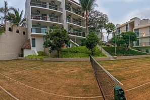 Tennis enthusiasts can enjoy a game on the adjacent court with a scenic view of the surrounding landscape.