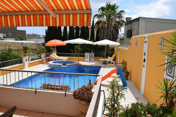 Outdoor pool, pool umbrellas, pool loungers