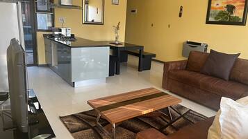 Comfort-lejlighed - udsigt til have | Opholdsområde | Fladskærms-tv