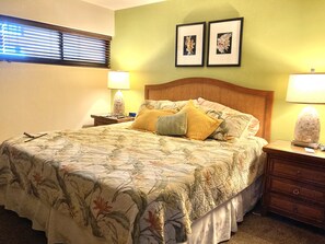A neatly made bed with floral bedding, two bedside lamps, and a nightstand with a lamp. - 🤙 Sept-Oct-Nov SPECIALS PLUS VRBO discounts 🏝️ at the LIVE ALOHA SUITE (Kihei)