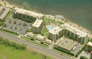 An aerial view of a hotel with multiple buildings, a parking lot, and a pool area. - 🤙 Sept-Oct-Nov SPECIALS PLUS VRBO discounts 🏝️ at the LIVE ALOHA SUITE (Kihei)