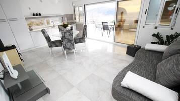 Apartment, 1 Bedroom, Balcony, Sea View | Living area | Flat-screen TV
