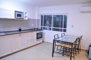 Full-size fridge, microwave, stovetop, electric kettle