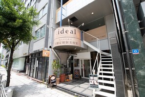 A building with a sign reading "ideal" and a staircase leading to the entrance. - East End BLD (Osaka)