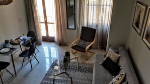Habitación Deluxe, 1 cama de matrimonio con sofá cama | Sala de estar