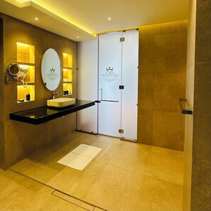 A modern bathroom with a vanity, a mirror, a hairdryer, and a towel rack. - Kings Landing Unawatuna (Unawatuna)