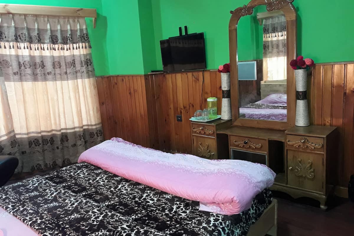 Habitación triple Deluxe, 1 cama King size, para fumadores, vista al valle | Servicios de la habitación