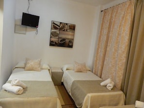 Economy Quadruple Room | Iron/ironing board, free WiFi, bed sheets, wheelchair access - Hostal El Rincon De Carlota (Seville)