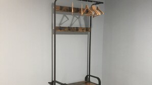 A metal-framed, wooden bench with a shelf and a hanging rack. - Terrazza Carlo terzo (Naples)