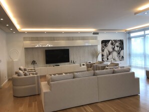 Deluxe Room, 2 Double Beds, Non Smoking, Canal View | Living area | Flat-screen TV, Netflix